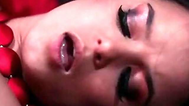 Beautiful brunette girl gets her pussy toyed with red dildo