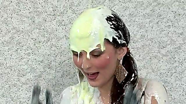 Fancy clothed lesbos get messy with paint in a pool