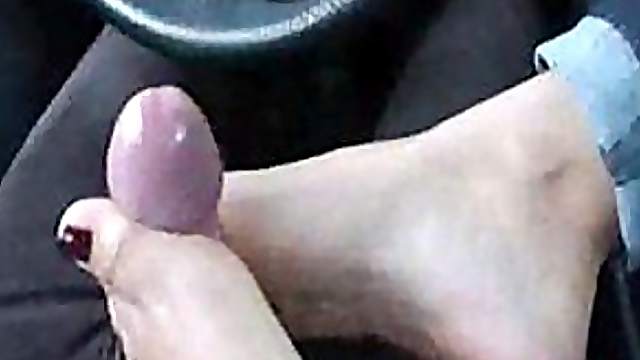 Kinky Blonde Giving a Footjob in the Car