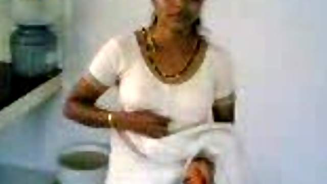 Horny Indian housewife takes her bra off to show tits