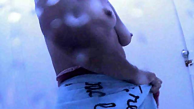 Hidden cam in a cabin catches a mature lady's hairy pussy