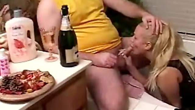 Chubby blonde mom enjoys licking a small cock in a bathroom