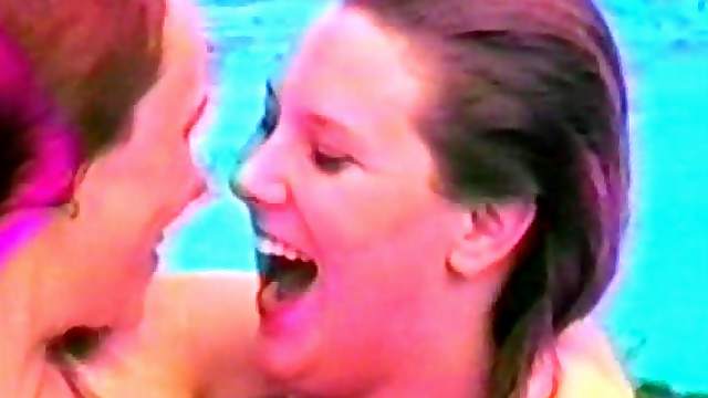 Horny lesbians are kissing in the swimming pool