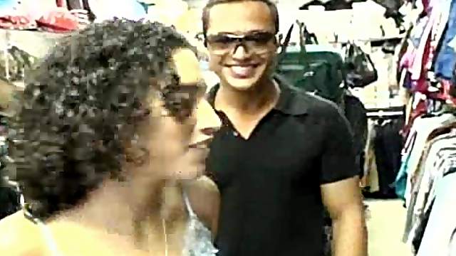 Curly-haired Latina Selena strips and gives a blowjob to a man