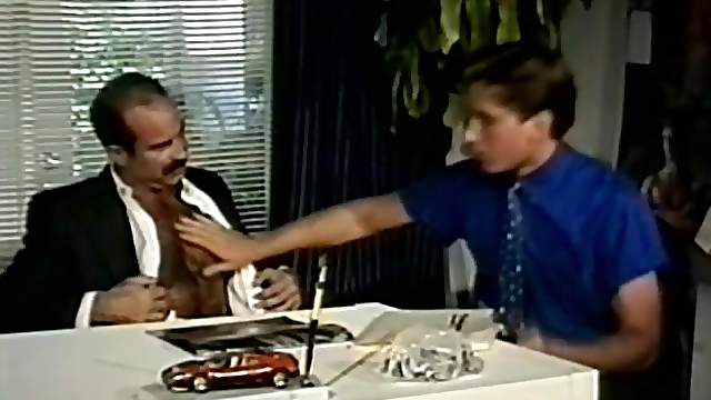 Horny gay bear drills a dude's asshole from behind in an office