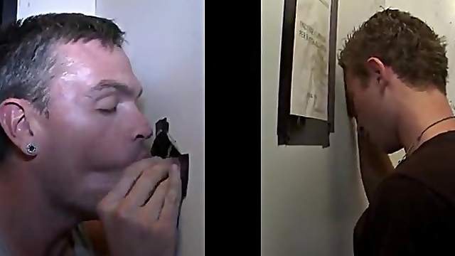 Busty gay with studs giving his gentleman blowjob through gloryhole