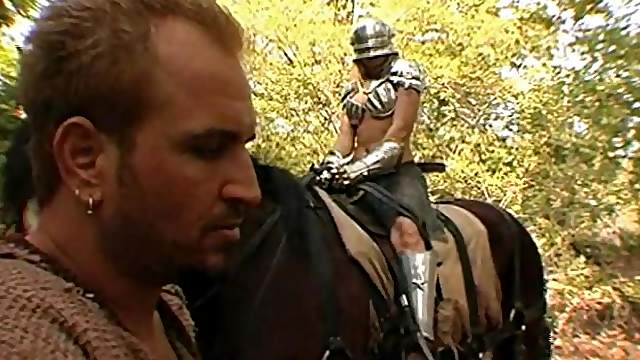 An armored babe comes across a stud in the woods that she fucks