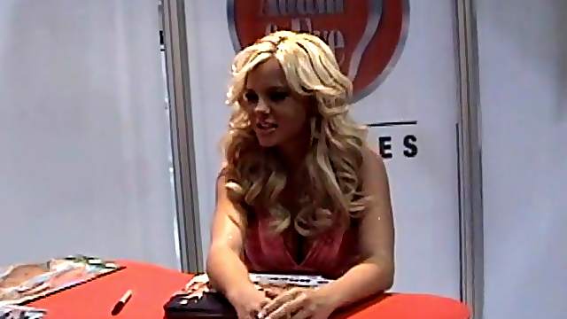 Busty blonde Bree Olson takes pictures with fans at a convention