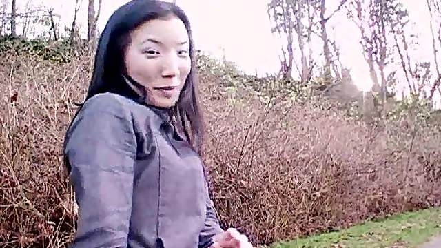 Japanese amateur on an empty beach playfully strips and romps