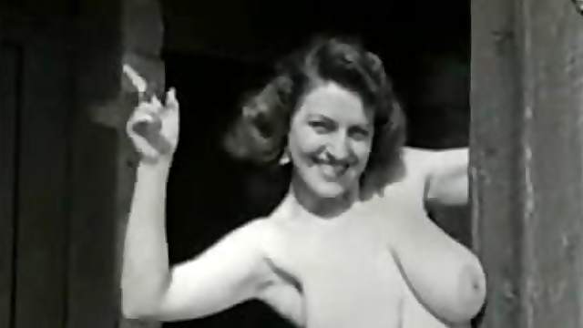 Retro solo clip with a brunette milf showing her big natural tits