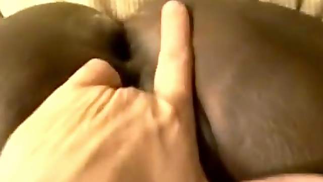 Black hussy gets her shaved coochie fingered in homemade scene