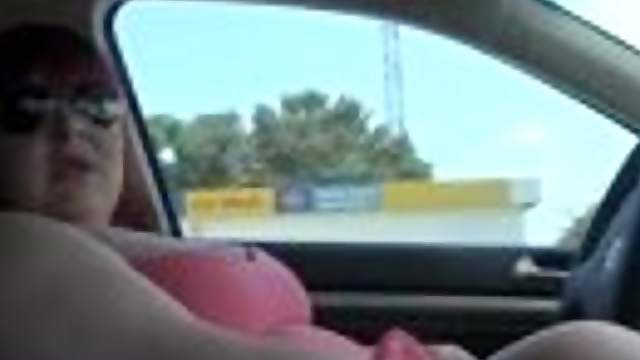 Obese skank wearing glasses rubs her twat in a car