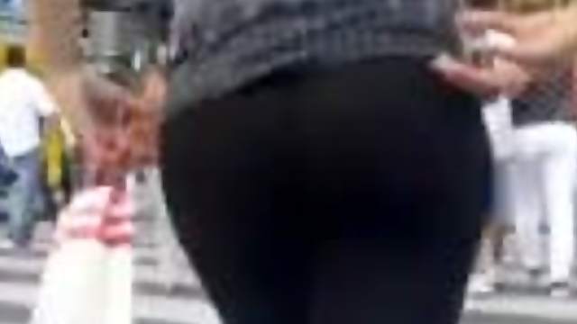 Sexy chick with nice butt gets caught on a hidded cam in the street