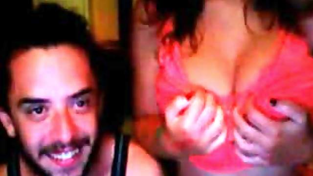 Sexy brunette shows her tits for the webcam in the presence of her BF