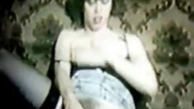 Woman in stockings fucks her cunt with a toy in homemade retro clip