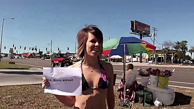 Slutty chick wearing a miniskirt shows her tits and pussy outdoors