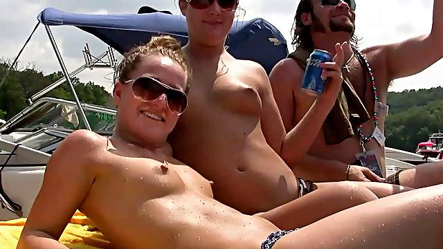 Randy chicks on the yacht party licking on natural tits