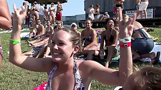 Outdoor reality clip with chicks wearing bikinis having fun at a party