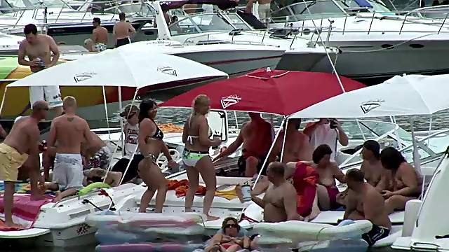 Some slutty chicks flash their nude bodies during a beach party