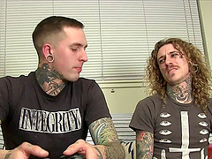Tattooed gay guy with long dark blonde hair enjoying an awesome ass fuck