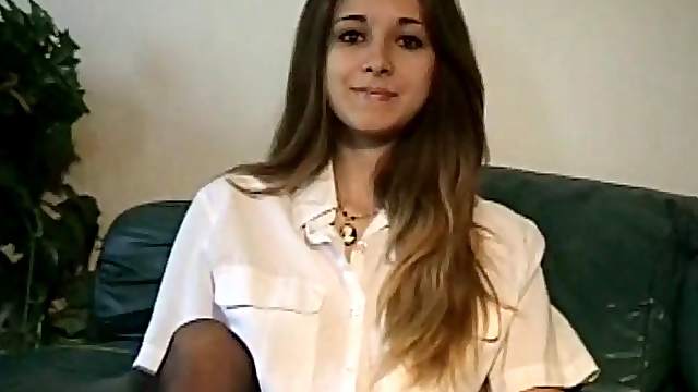 Horny amateur sits on a couch rubbing and touching herself