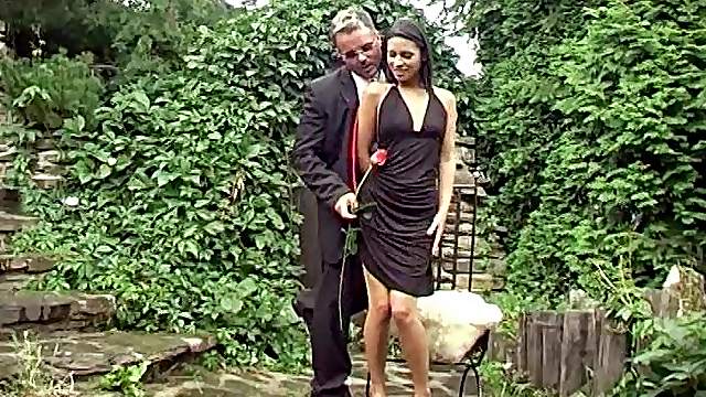 Out in a part he lifts up her dress and drills her in the ass