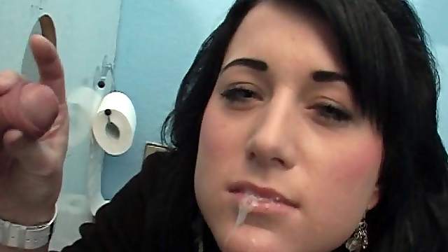 Sweater girl at the gloryhole gladly makes his cock cum