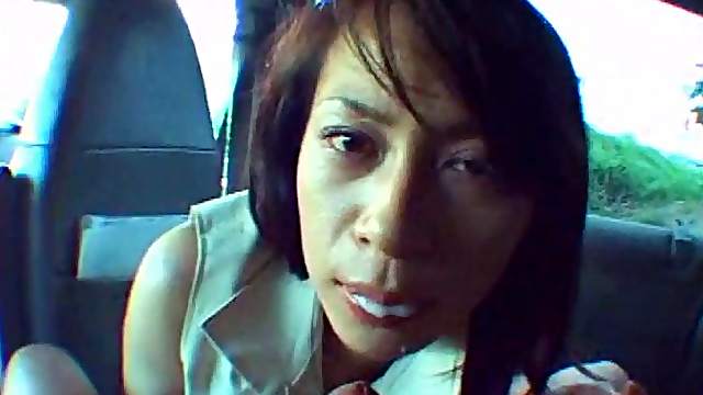 Adorable Asian vixen gives head in the car in a pov clip