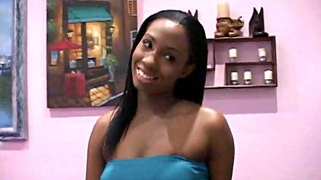 Ebony vixen jerks off a stiff pecker and gets cum on her tits