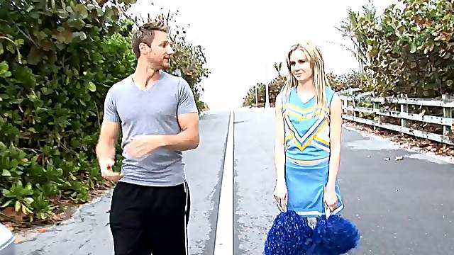 A cute cheerleader does a cheer and accepts a dick