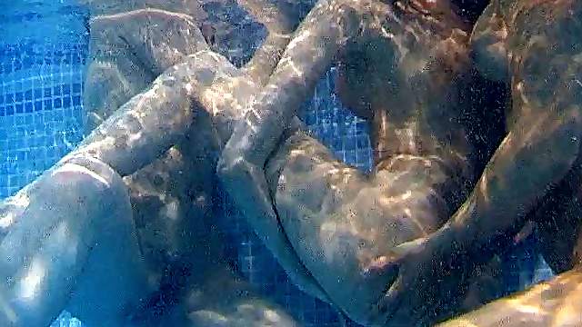 Icy hot lesbian babes get frisky in the pool in an enticing threesome
