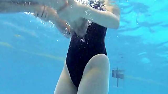 An athletic Japanese girl on the swim team fucks her coach