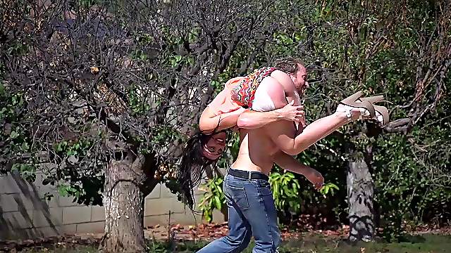 Oiled chick has her pink cunt stretched