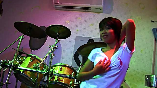 Sexy babe erotically strips to th e soothing beats of the music
