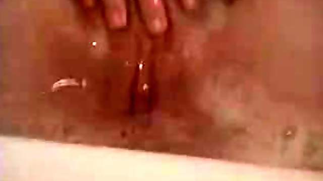 Teen brunette Masturbating Her Pink Shaved Pussy While Taking A Bath