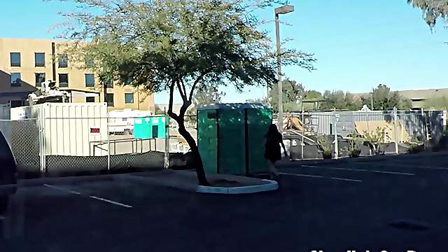 Teen swallows strangers cum in porta potty gloryhole in public parking lot