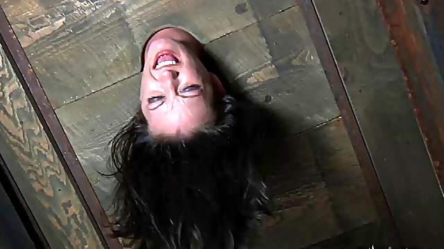 BDSM porn shoot of brunette slave yelling when spanked