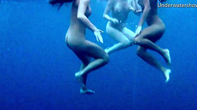 Luscious honeys love undressing while diving in the water