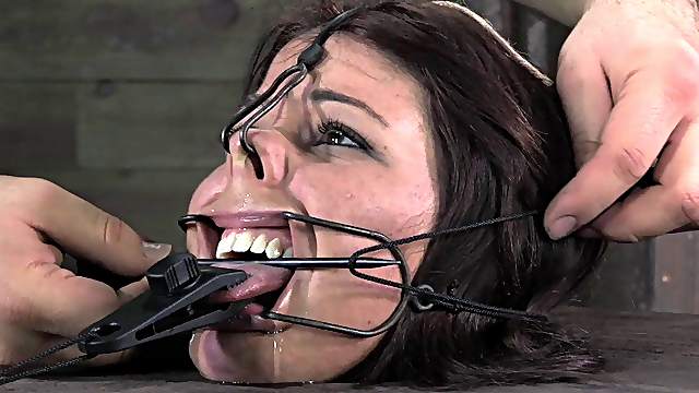 Naughty bitch Mia simply enjoys being restrained in the dungeon