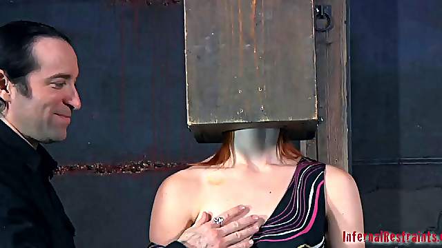 Damon Pierce has a box on her head during a kinky game