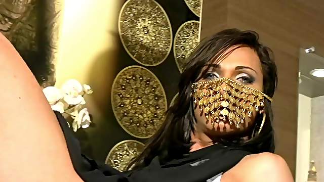 Masked ladyboy performing an outstanding striptease