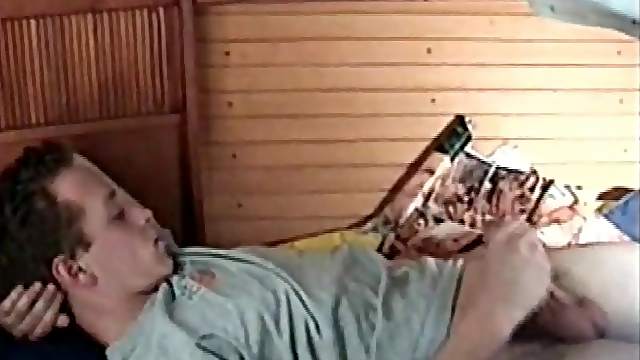 Calvin in the aft cabin of a boat and reading a porn magazine again.