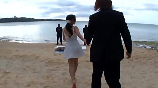 Asian hottie Mizuki Miri places her hairy twat on a cock at the beach