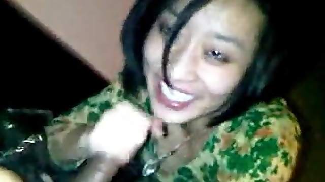 A horny asian slut gets filmed while giving her man a blowjob