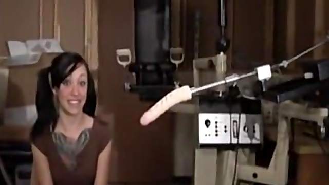Cutie with a big tattoo enjoys being fucked with a sex machine