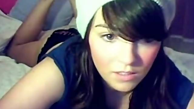 Hot chick stripping at home. She has a very cute face.