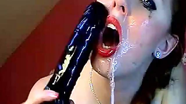 Aurelie likes to gag herself with her big dildo