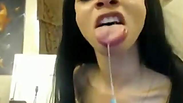 Dark haired babe talks dirty in her bedroom