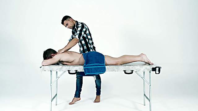 Gay Latino masseuse gives a white guy a nice cock massage