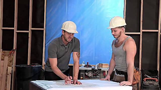 Gay workers take a break to ride one another on the table